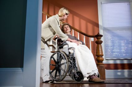 Staff member with elder women in a wheelchair